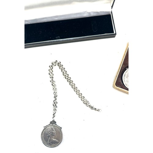 352 - Silver chain with a mounted one dollar coin and a silver coin with copper chain