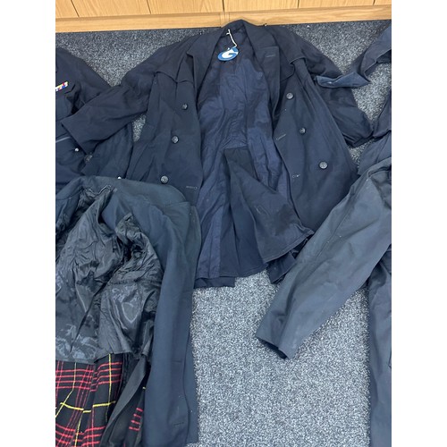 290 - Selection of mens vintage police officer clothing to include tunics and over coats