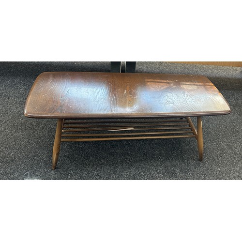 579 - Ercol coffee table measures approximately 41 inches long x 18 wide and 14 tall- broken spindal