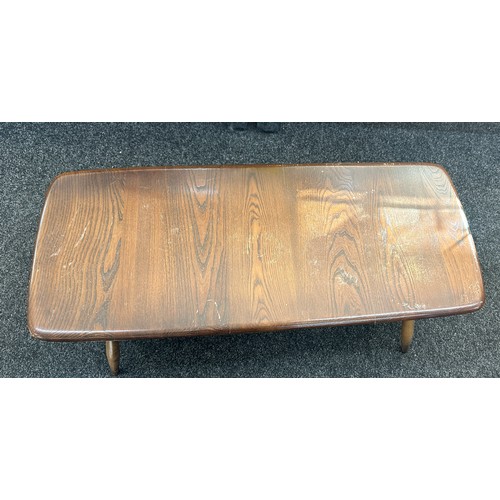 579 - Ercol coffee table measures approximately 41 inches long x 18 wide and 14 tall- broken spindal