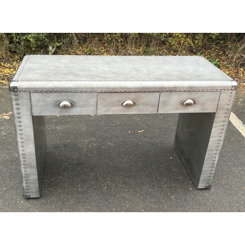 566 - 3 Drawer metal look desk measures approximately 30inches tall 48 inches wide 20 inches depth