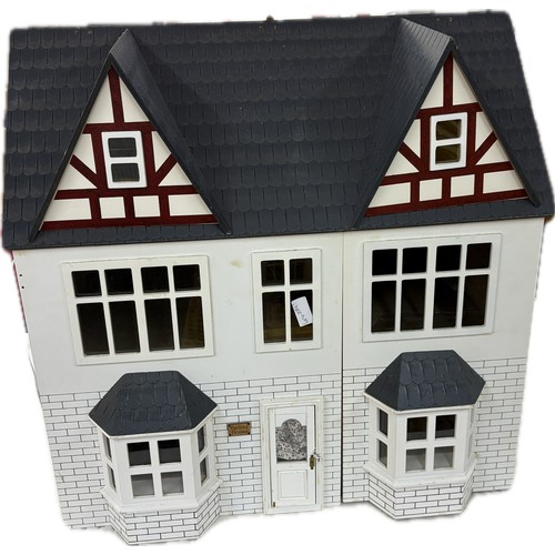 569 - Childrens dolls house, approximate measurements Height 24 inches, width 24 inches, depth 16 inches