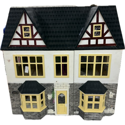 565 - Childrens dolls house, approximate measurements Height 24 inches, width 24 inches, depth 16 inches