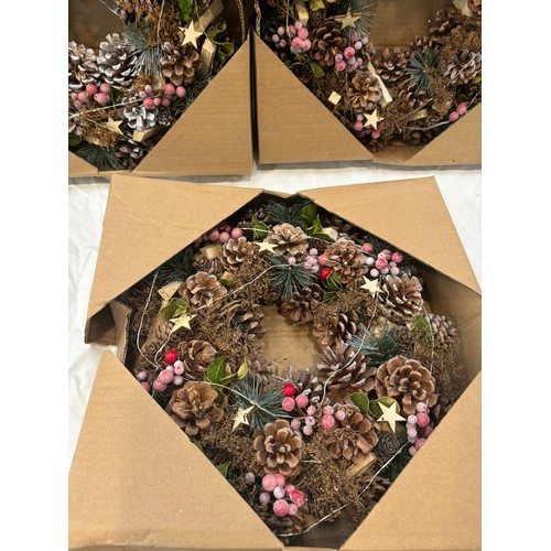 213 - Three boxed christmas wreaths, 36cm diameter