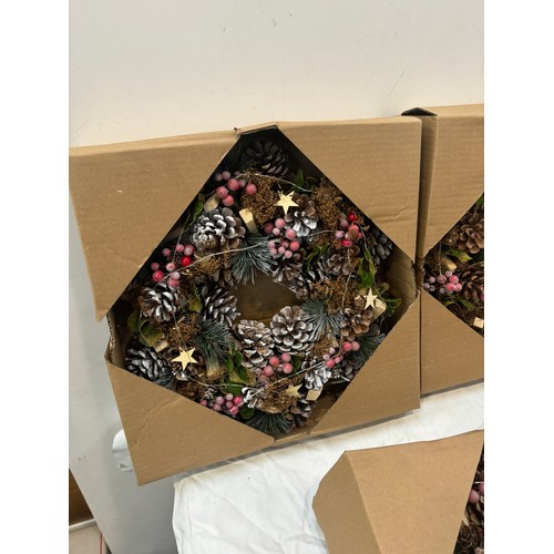 213 - Three boxed christmas wreaths, 36cm diameter