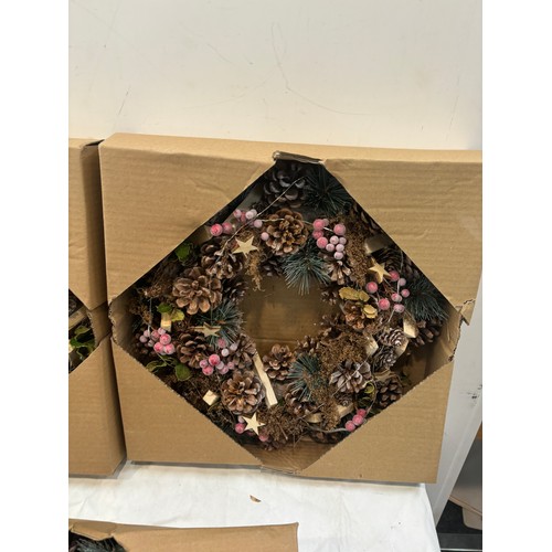 213 - Three boxed christmas wreaths, 36cm diameter