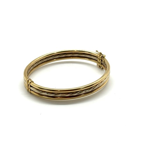 443 - Ladies 9ct gold bangle total weight 11 grams