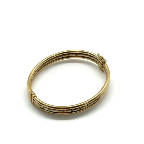 443 - Ladies 9ct gold bangle total weight 11 grams