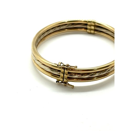 443 - Ladies 9ct gold bangle total weight 11 grams