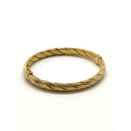 434 - Ladies 9ct gold bangle total weight 10 grams