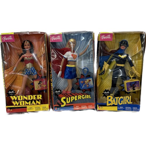 66 - Three original boxed Barbie Super Heroes to include ' Supergirl', ' Batgirl' and ' Wonder Woman'