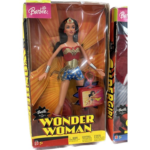 66 - Three original boxed Barbie Super Heroes to include ' Supergirl', ' Batgirl' and ' Wonder Woman'