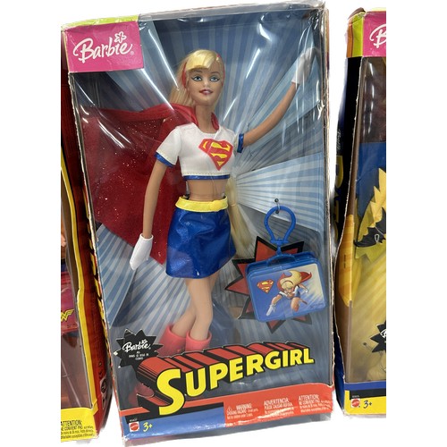 66 - Three original boxed Barbie Super Heroes to include ' Supergirl', ' Batgirl' and ' Wonder Woman'