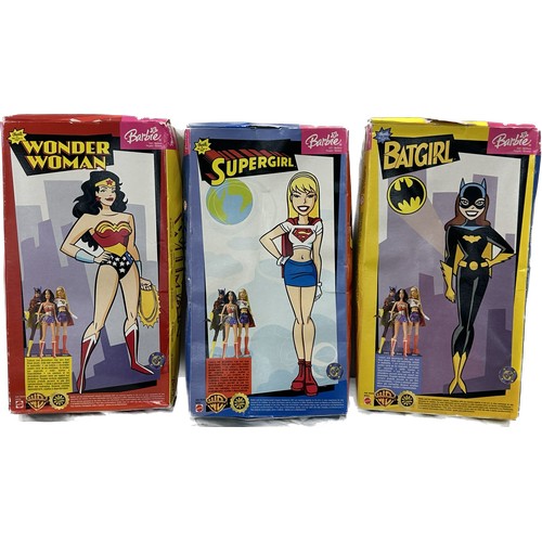 66 - Three original boxed Barbie Super Heroes to include ' Supergirl', ' Batgirl' and ' Wonder Woman'