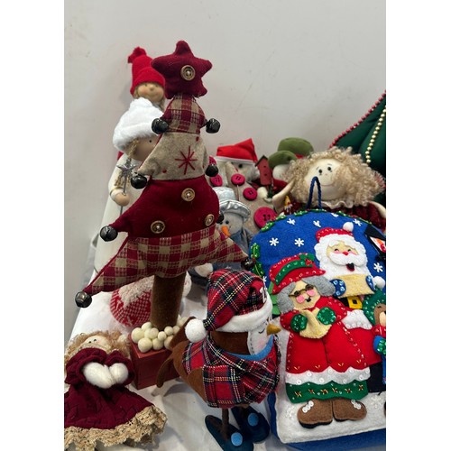 147 - Selection of christmas decorations includes christmas trees, door stops etc