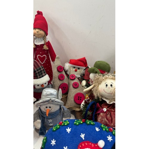 147 - Selection of christmas decorations includes christmas trees, door stops etc