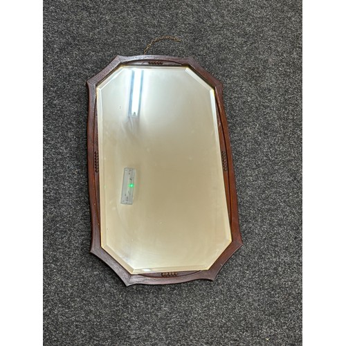 63 - Oak framed bevelled mirror 26 inches by 15 inches