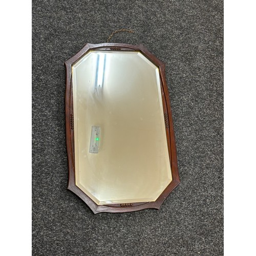 63 - Oak framed bevelled mirror 26 inches by 15 inches