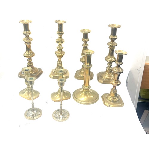 77 - Large selection of brass candle sticks