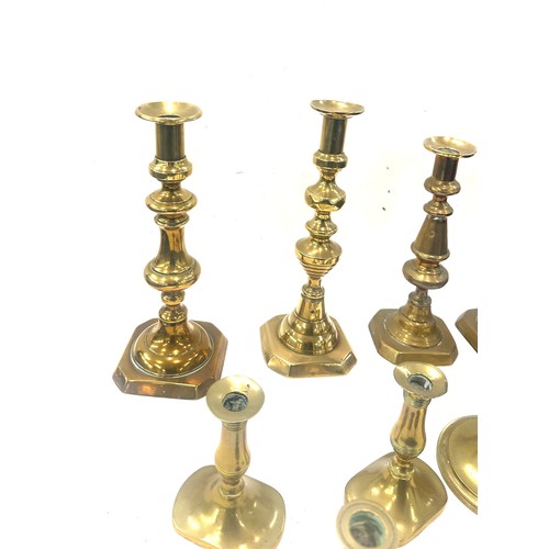 77 - Large selection of brass candle sticks