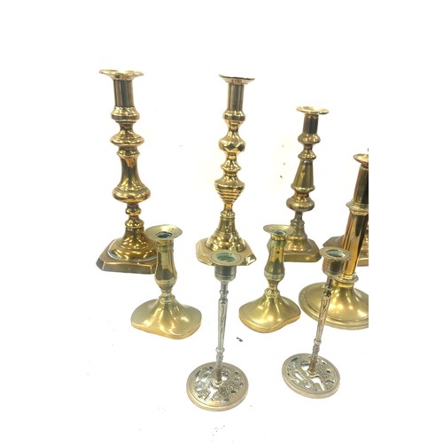 77 - Large selection of brass candle sticks