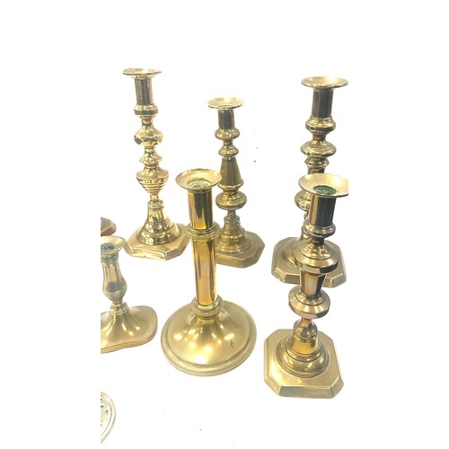 77 - Large selection of brass candle sticks