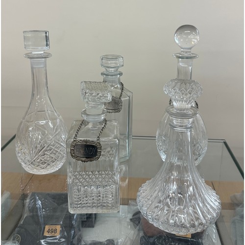 125 - Selection of glass ship decanters with tags