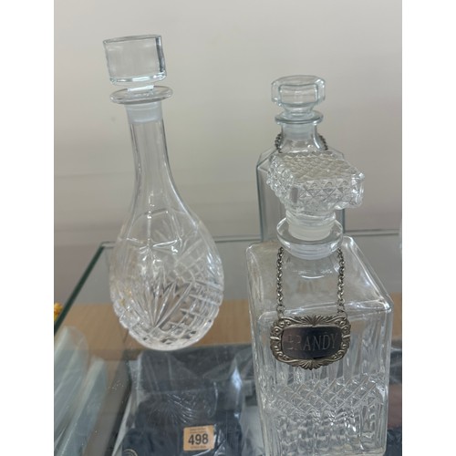 125 - Selection of glass ship decanters with tags