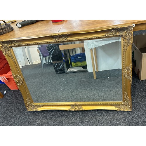 226 - Gilt framed wall hanging mirror measures approx 42 inches wide by 30 tall