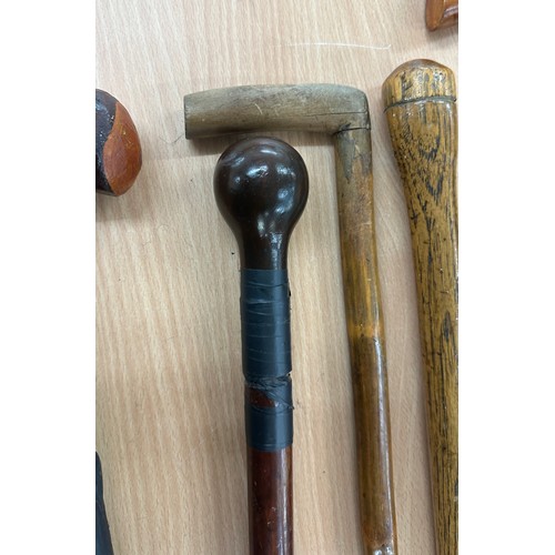 232 - Five assorted vintage walking sticks