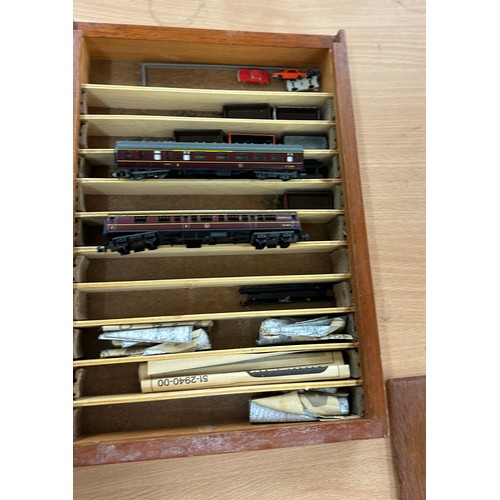 32 - Selection of miniature train models in wooden casing