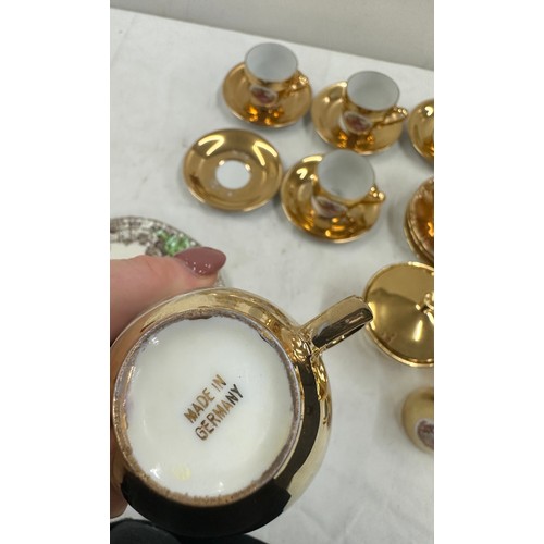 187 - German part tea service gold coloured porcelain and a collectors plate