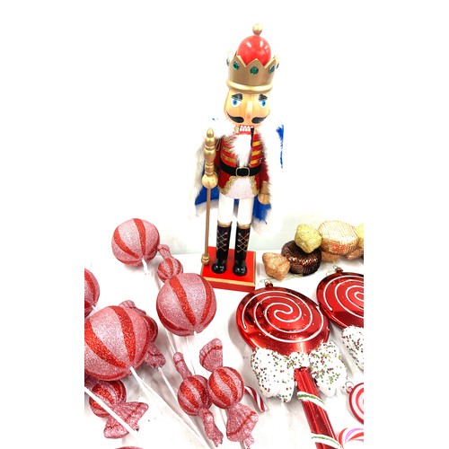 186 - Selection of Christmas decorations ' Candy Land' theme to include large sweet decorations, a nut cra... 