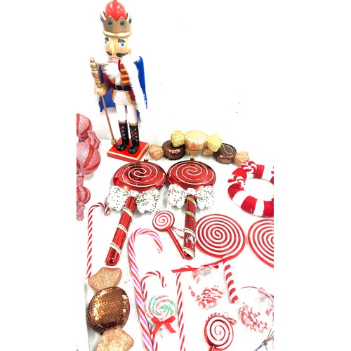 186 - Selection of Christmas decorations ' Candy Land' theme to include large sweet decorations, a nut cra... 