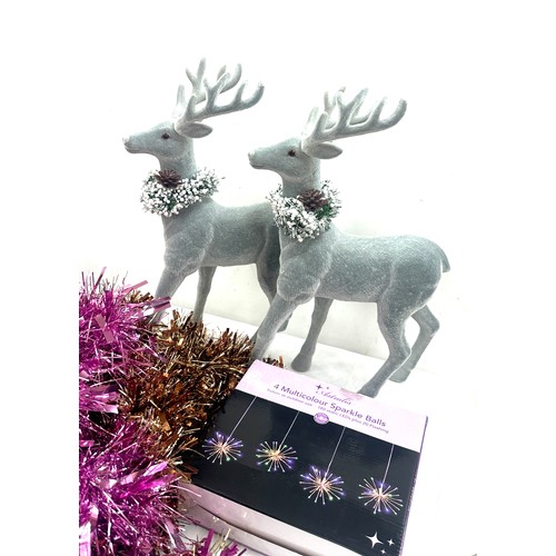 205 - Selection of Christmas decorations to include a pair of Reindeer figures, tinsel, baubles etc