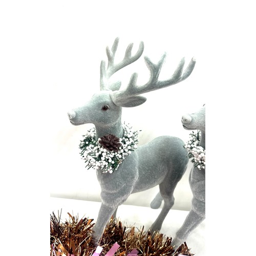 205 - Selection of Christmas decorations to include a pair of Reindeer figures, tinsel, baubles etc