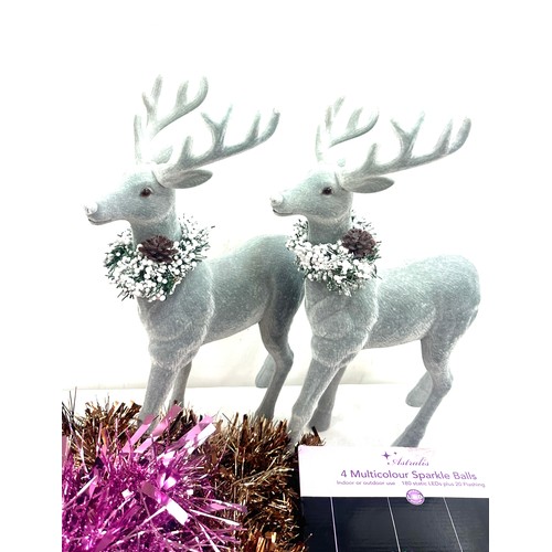 205 - Selection of Christmas decorations to include a pair of Reindeer figures, tinsel, baubles etc