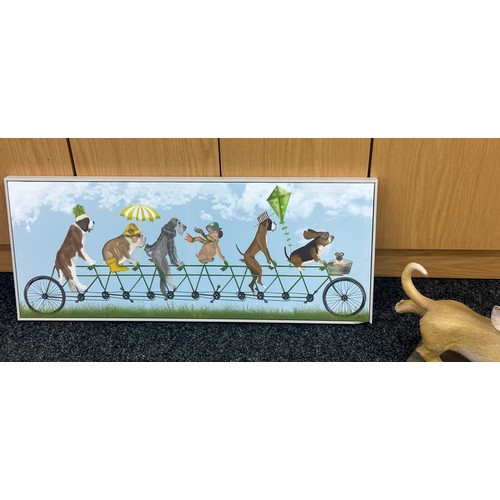 190 - Signed dog print on canvas along with a dog figure