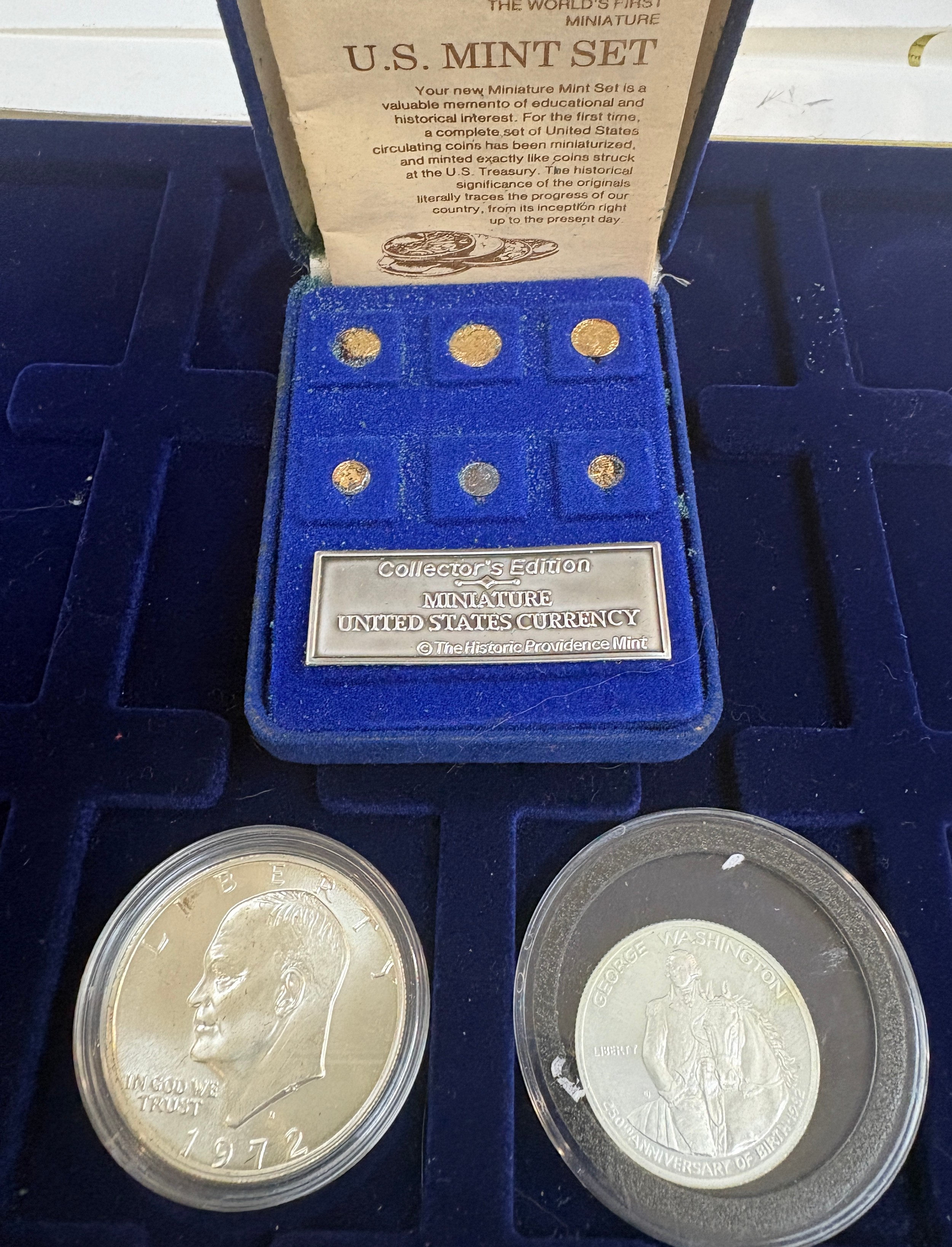 Silver Liberty one dollar 1972 US coin, Silver George Washington half  dollar coin both in capsules,