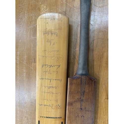 249 - 2 Vintage wooden cricket bats, one signed