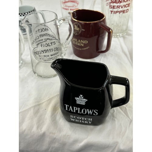 211 - Selection of pub advertising jugs