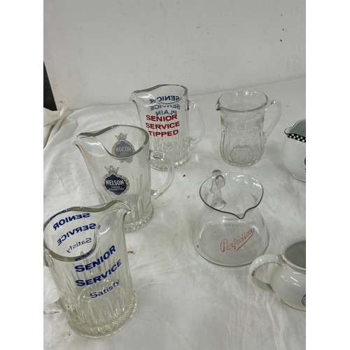 211 - Selection of pub advertising jugs