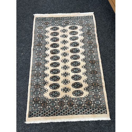 214 - Vintage lounge rug measures approximately 60 inches by 41 inches