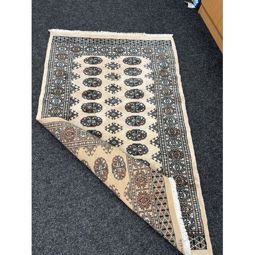 214 - Vintage lounge rug measures approximately 60 inches by 41 inches