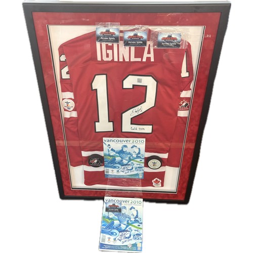 Framed signed Jarome Iginla Vancouver 2010 autographed official jersey, programme and pucks achieving Gold 2010, all within a wall hanging framed presentation, COA by HockeyInk, together with an additional signed programme