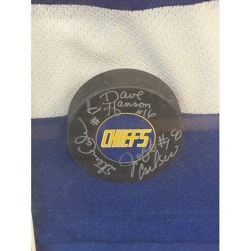 232 - Framed signed Charlestown Chiefs autographed official jersey, photo and puck all within a wall hangi... 