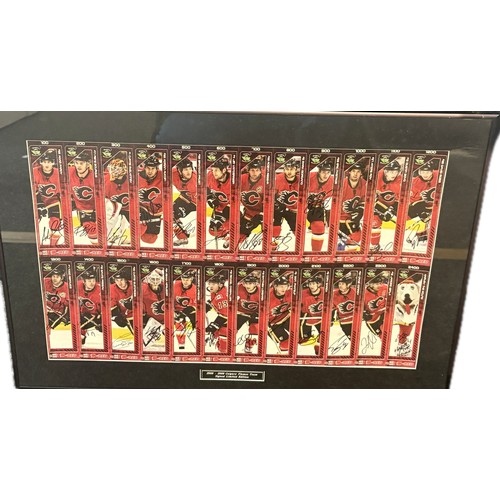 81 - Framed limited edition 2008-2009 Calgary Flames team autographs. frame size 20.5 by 29 inches