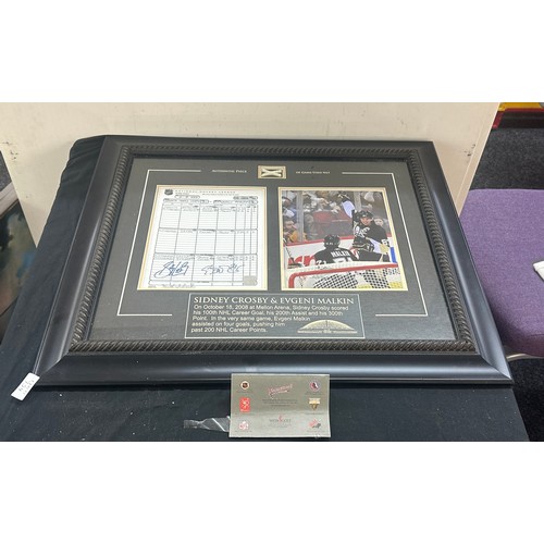 61 - Sidney Crosby and Evgeni Malkin signed Hockey league sheet, together with an authentic piece of game... 