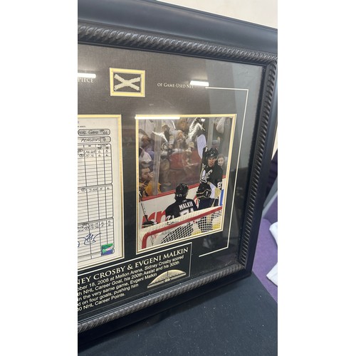 61 - Sidney Crosby and Evgeni Malkin signed Hockey league sheet, together with an authentic piece of game... 