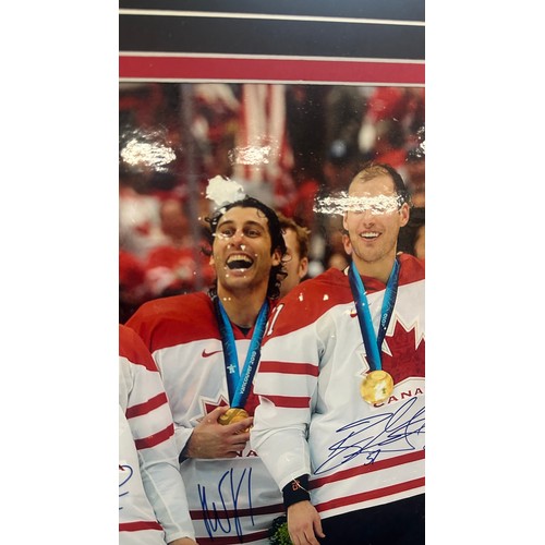 152 - Autographed Team Canada Gold from Vancouver olympic Games 2010, unfortunately damage has been sustai... 